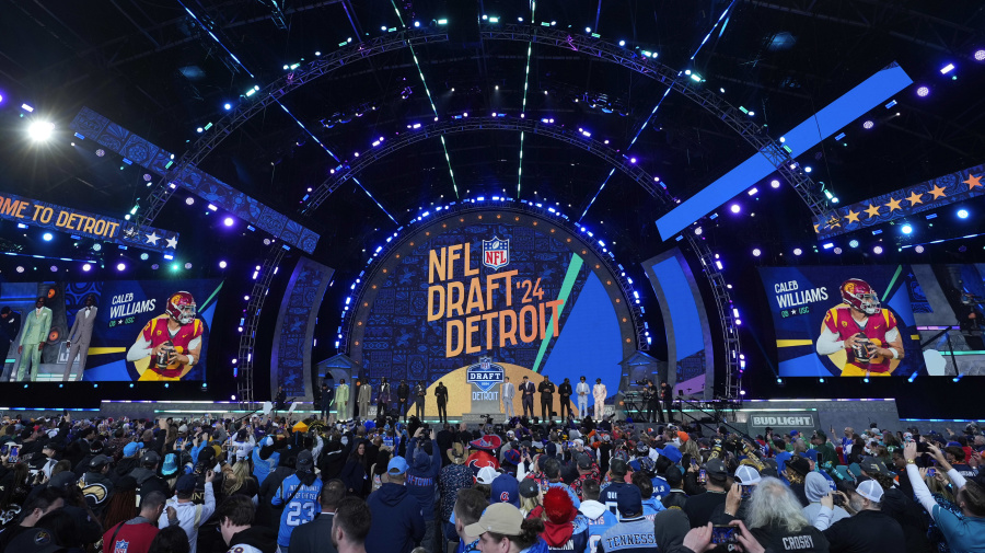 Associated Press - Top prospects stand on stage before the first round of the NFL Draft, April 25, 2024, in Detroit. (AP Photo/Paul Sancya)