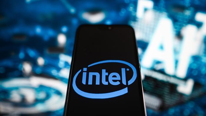 POLAND - 2023/07/19: In this photo illustration an Intel logo is displayed on a smartphone with Artificial Intelligence (AI) symbols in the background. (Photo Illustration by Omar Marques/SOPA Images/LightRocket via Getty Images)