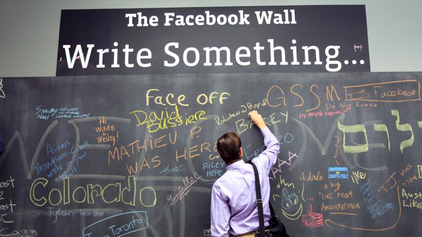 An employee writes a note on the message board at the new headquarters of Facebook in Menlo Park, California January 11, 2012. The 57-acre campus, which formerly housed Sun Microsystems, features open work spaces for nearly 2,000 employees on the one million square foot campus, with room for expansion. Picture taken January 11, 2012. REUTERS/Robert Galbraith  (UNITED STATES - Tags: SCIENCE TECHNOLOGY MEDIA TPX IMAGES OF THE DAY)