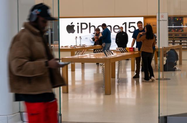 NEW YORK, NEW YORK - FEBRUARY 01: People walk by an Apple store in a shopping mall in lower Manhattan on February 01, 2024 in New York City. Apple will report earnings Thursday afternoon after the close of the Closing Bell. The iPhone maker, which is to release its Vision Pro mixed-reality headset on Friday, has seen revenue decline for each of its past four reported quarters. (Photo by Spencer Platt/Getty Images)