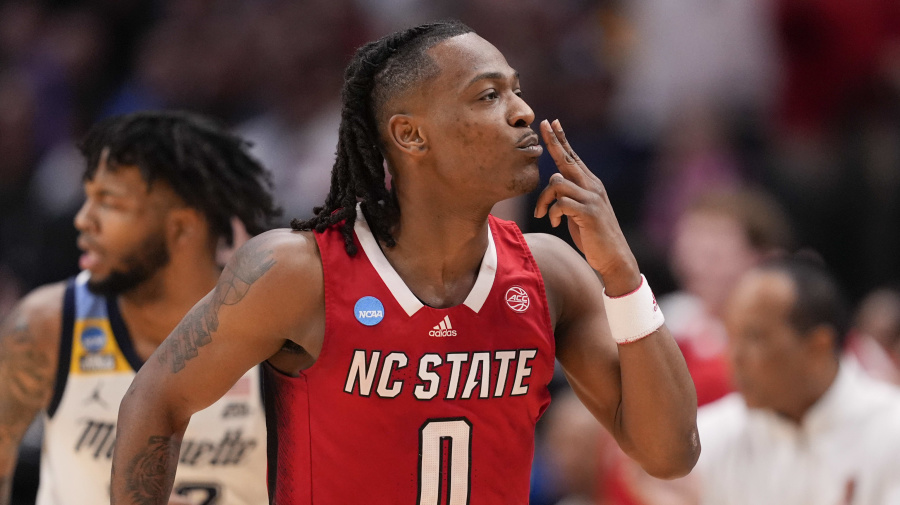 Associated Press - North Carolina State's DJ Horne reacts after scoring a basket against Marquette during the second half of a Sweet 16 college basketball game in the NCAA Tournament in Dallas, Friday, March 29, 2024. (AP Photo/Tony Gutierrez)