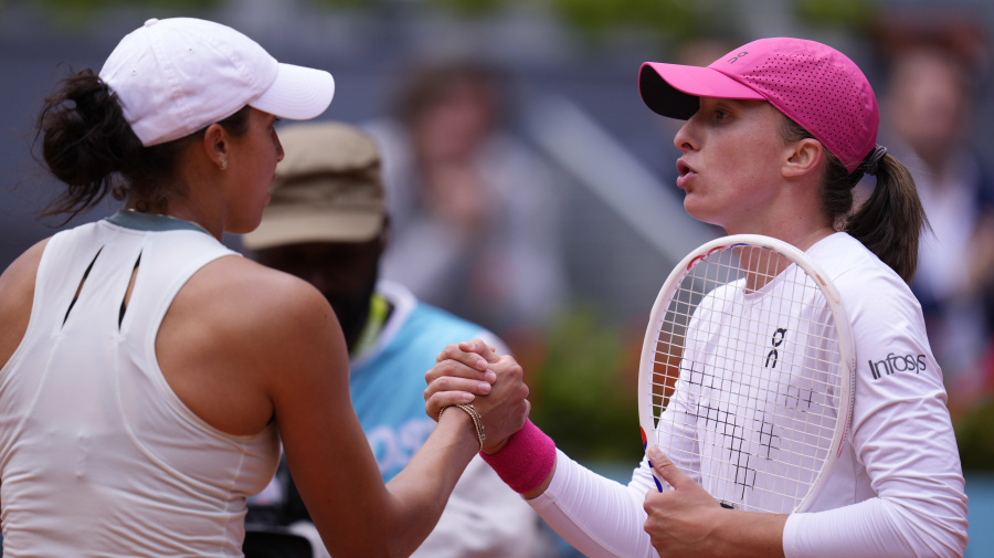 Associated Press - Iga Swiatek of Poland, right, shakes hands with Madison Keys of USA after winning their match during the Mutua Madrid Open tennis tournament in Madrid, Spain, Thursday, May 2, 2024. (AP Photo/Manu Fernandez)