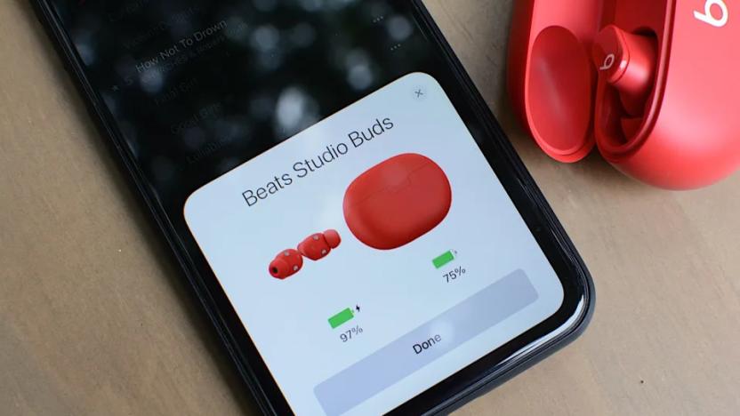 Beats Studio Buds in red pairing with a phone