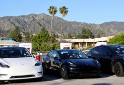 BURBANK, CALIFORNIA - APRIL 14: Tesla cars recharge at a Tesla Supercharger station on April 14, 2022 in Burbank, California. California has unveiled a proposal which would end the sale of gasoline-powered cars while requiring all new cars to have zero emissions by 2035. (Photo by Mario Tama/Getty Images)