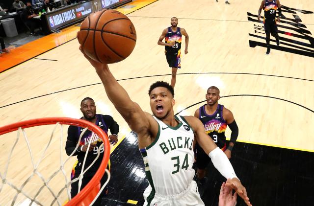 Jul 8, 2021; Phoenix, Arizona, USA; Milwaukee Bucks forward Giannis Antetokounmpo (34) moves in for a basket ahead of Phoenix Suns forward Jae Crowder (99) and guard Chris Paul (3) during game two of the 2021 NBA Finals at Phoenix Suns Arena. Mandatory Credit: Mark J. Rebilas-USA TODAY Sports     TPX IMAGES OF THE DAY