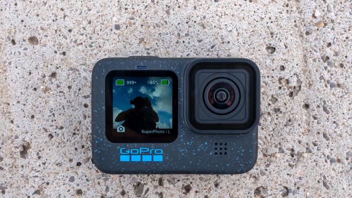 The new Hero 12 Black camera from GoPro is pictured against a concrete background.