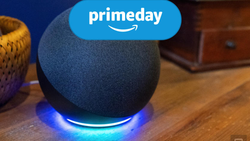 The Echo speaker sits on a wooden table with the blue ring illuminated at the bottom. Engadget's Prime Day logo is at the top of the image.