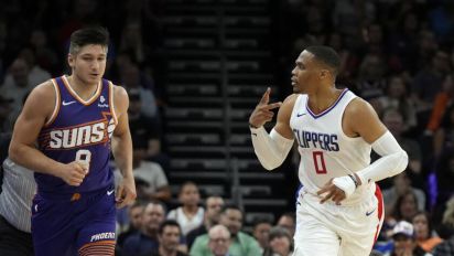 LA Times - The Clippers withstand a furious Suns' rally for a win that guarantees a top-five finish in the Western