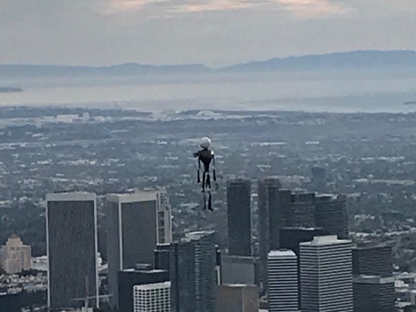 Officials were stumped after pilots reported seeing a jetpack in the air near LAX. Now, video shows it may have just been a human-shaped balloon.