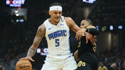 Reuters - May 5, 2024; Cleveland, Ohio, USA; Orlando Magic forward Paolo Banchero (5) drives to the basket against Cleveland Cavaliers forward Isaac Okoro (35) during the first quarter of game seven of the first round for the 2024 NBA playoffs at Rocket Mortgage FieldHouse. Mandatory Credit: Ken Blaze-USA TODAY Sports