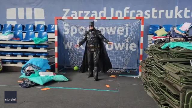 Batman' Becomes Goalkeeper for Soccer Game at Polish Refugee Shelter