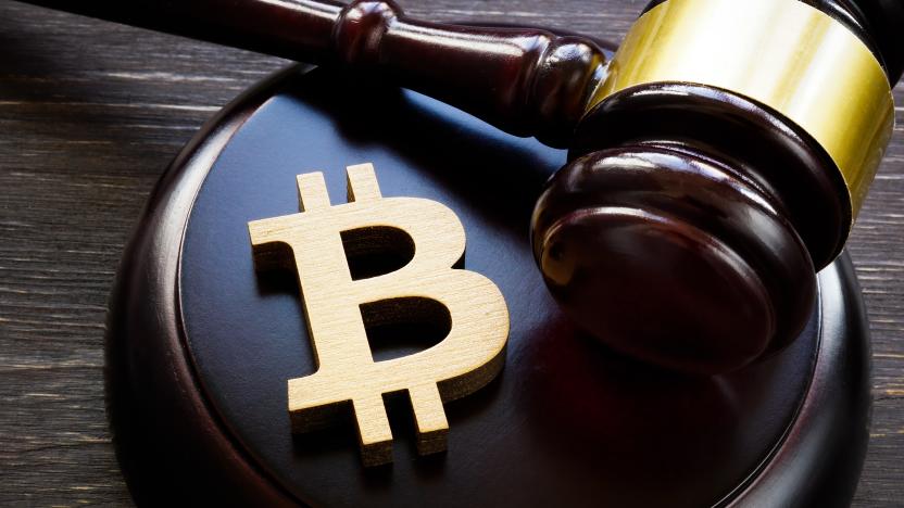 Bitcoin symbol and gavel to regulate cryptocurrencies market.