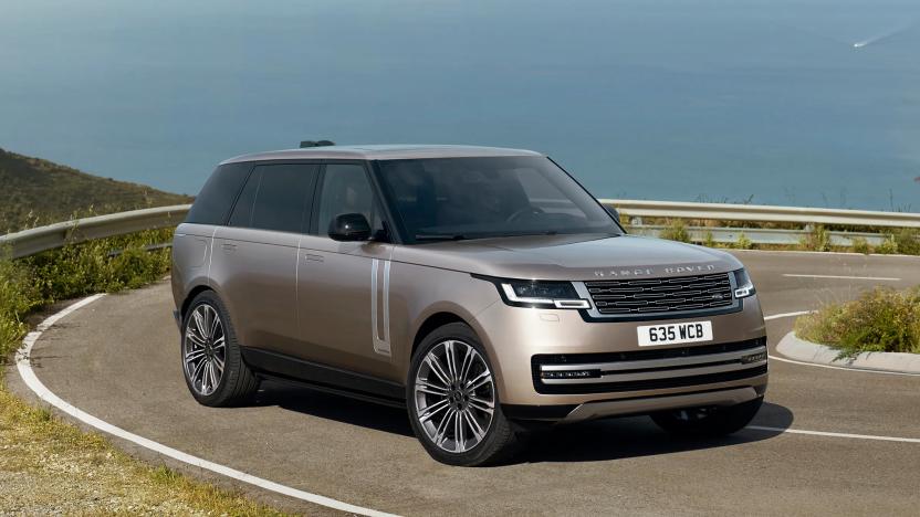 The 2023 Range Rover parked on an oceanside turn on a highway.