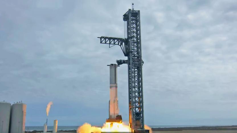 A still image from YouTube of the SpaceX Starship first full static fire test, showing the rocket firing while still attached to its support tower.