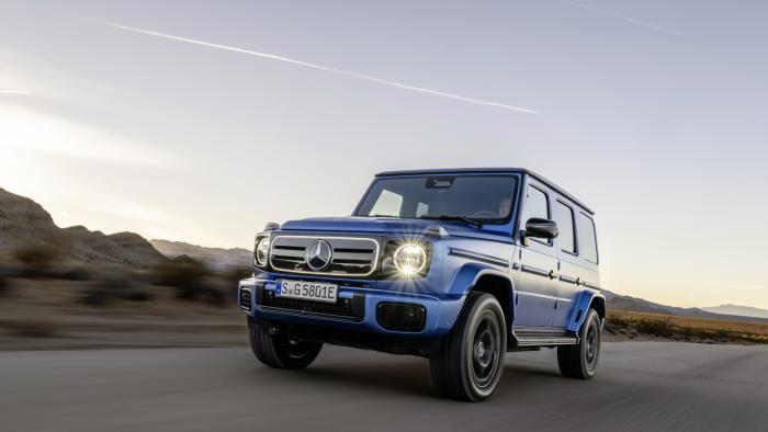 A blue all-terrain vehicle on the road.