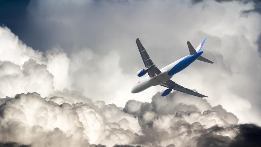 A commercial airplane flies through storm clouds. Flying in bad weather, turbulence in the sky