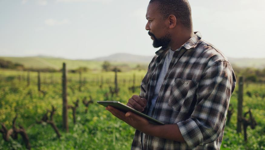 Shot of a mature man using a digital tablet while working on a farm