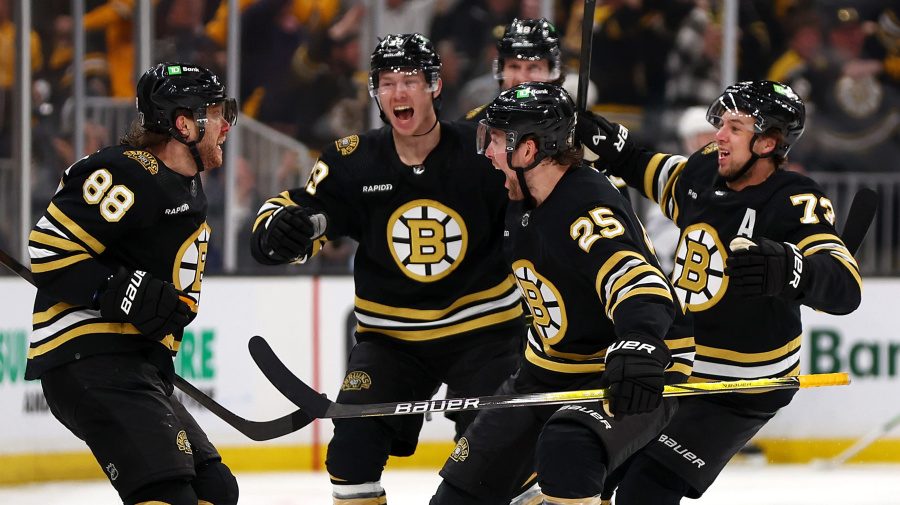 Getty Images - BOSTON, MASSACHUSETTS - MAY 04: David Pastrnak #88 of the Boston Bruins celebrates with Brandon Carlo #25, Charlie McAvoy #73 and John Beecher #19 after scoring the game winning goal against the Toronto Maple Leafs during overtime to win Game Seven of the First Round of the 2024 Stanley Cup Playoffs at TD Garden on May 04, 2024 in Boston, Massachusetts. (Photo by Maddie Meyer/Getty Images)