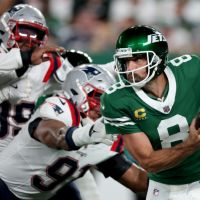 Rodgers shines as Jets down Patriots in NFL home opener