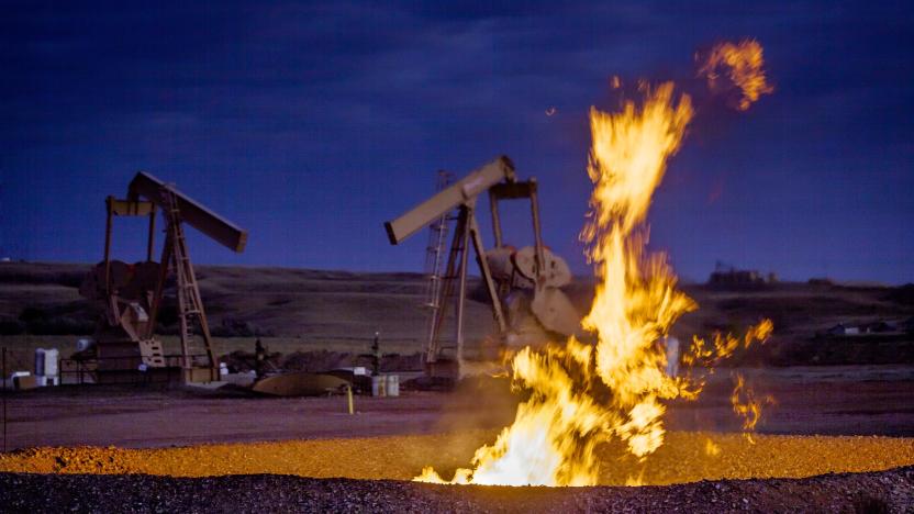 Flames from a flaring pit near a well in the Bakken Oil Field. The primary component of natural gas is methane, which is odorless when it comes directly out of the gas well. In addition to methane, natural gas typically contains other hydrocarbons such as ethane, propane, butane, and pentanes. Raw natural gas may also contain water vapor, hydrogen sulfide (H2S), carbon dioxide, helium, nitrogen, and other compounds. (Source: www.earthworksaction.org). As of July 2014, roughly 30 percent of the (Photo by Orjan F. Ellingvag/Corbis via Getty Images)