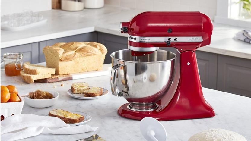 KitchenAid Artisan Stand Mixer and various breads on a countertop.