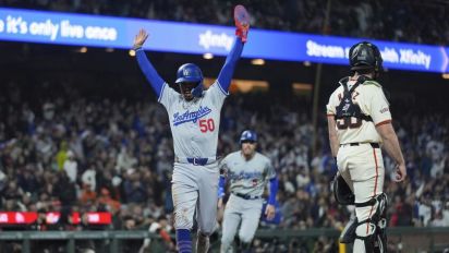 LA Times - Will Smith's two-run double in the 10th inning provides the difference in a game that has several lead