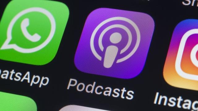 London, UK - July 24, 2018: The buttons of Podcasts, WhatsApp, Instagram, Pinterest, Twitter, Snapchat and other apps on the screen of an iPhone.