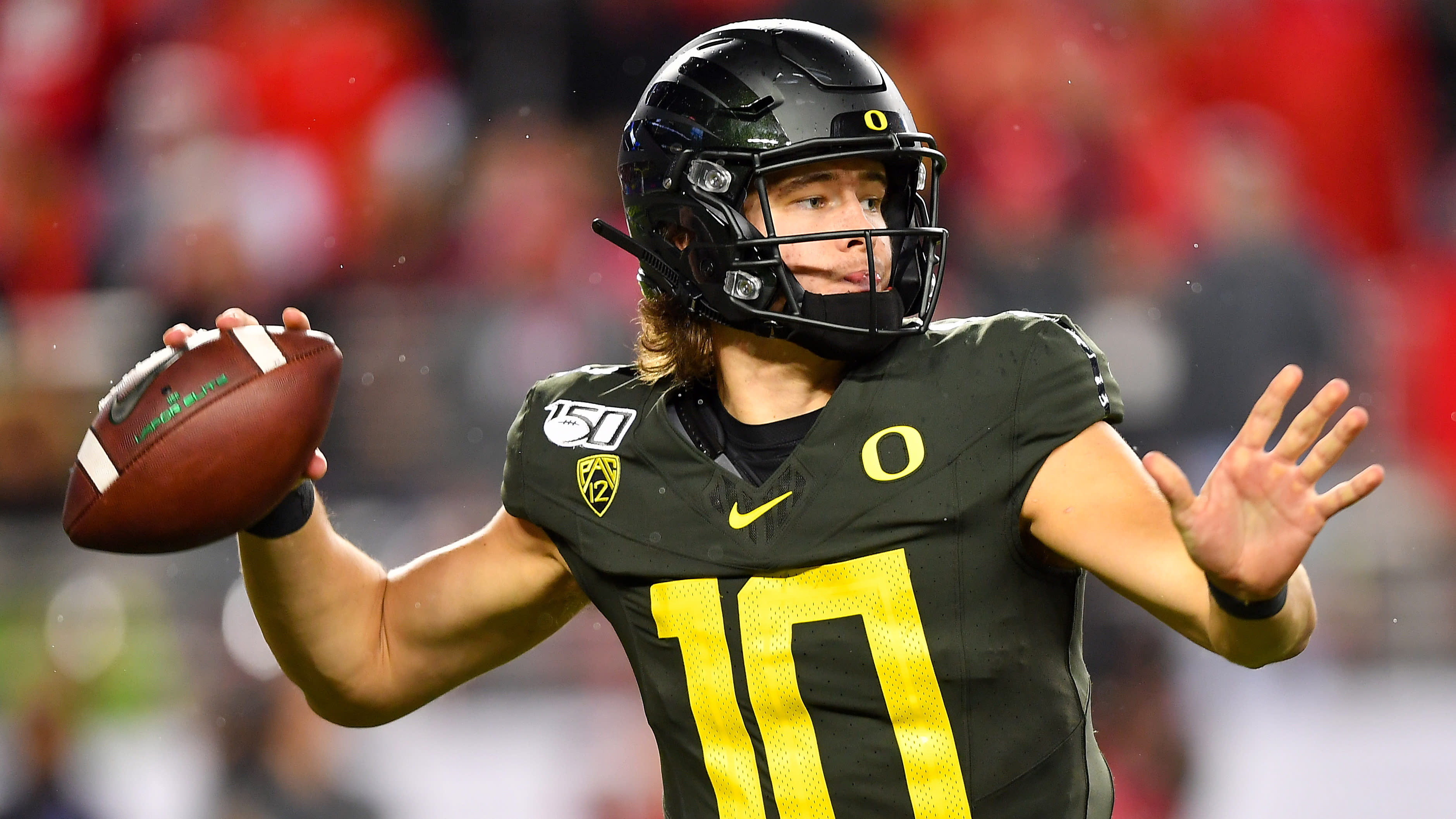 Oregon quarterback Justin Herbert (10) and tight end Patrick