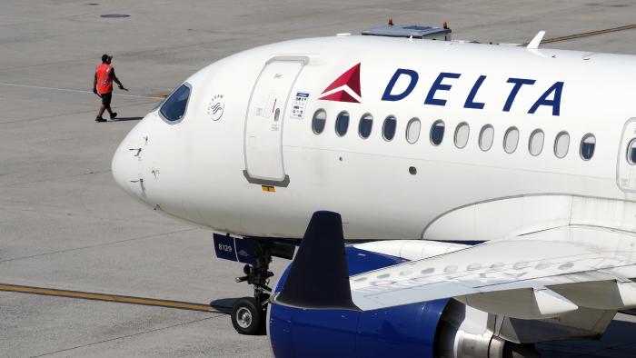 A Delta Air Lines jet leaves the gate, Friday, July 19, 2024, at Logan International Airport in Boston. (AP Photo/Michael Dwyer)