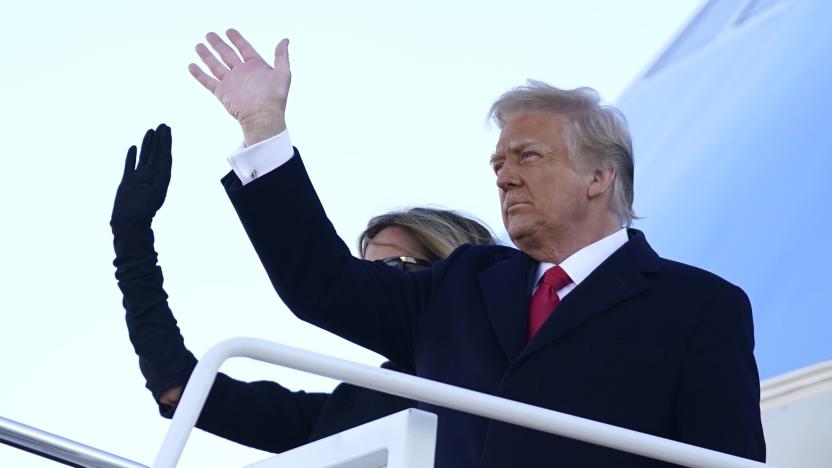 President Donald Trump and first lady Melania Trump board Air Force One at Andrews Air Force Base, Md., Wednesday, Jan. 20, 2021.(AP Photo/Manuel Balce Ceneta)