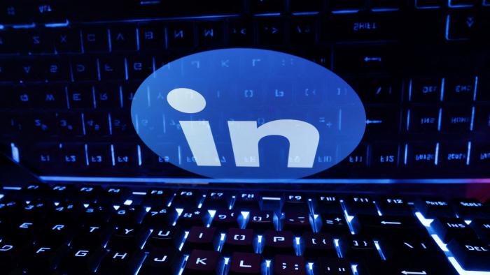 A keyboard is placed in front of a displayed LinkedIn logo in this illustration taken February 21, 2023. REUTERS/Dado Ruvic/Illustration