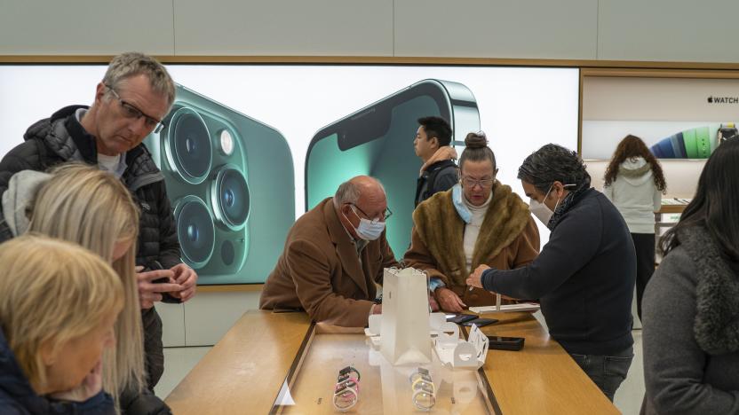 NEW YORK, NY - APRIL 17: Sales people advise customers as they look at Apple Watches at the World Trade Center Apple Store on April 17, 2022 in New York City. (Photo by Robert Nickelsberg/Getty Images)