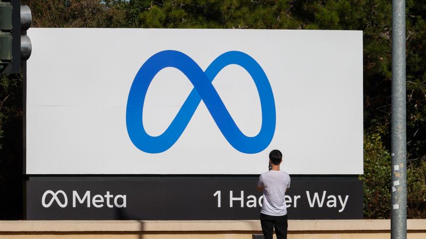 MENLO PARK, CA - OCTOBER 28: People take photos of the new "Meta" sign at the One Hacker Way in Menlo Park, as Facebook changes its company name to Meta in California, United States on October 28, 2021. (Photo by Tayfun Coskun/Anadolu Agency via Getty Images)