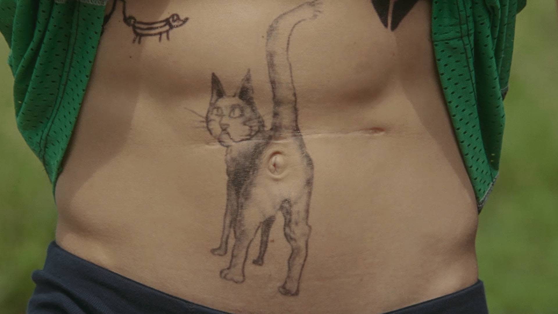 cat belly button tattoo