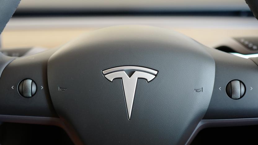 A TESLA model Y car sits inside a home garage whilst receiving a top up charge of solar powered electricity on October 03, 2023 in Ballina, Australia.