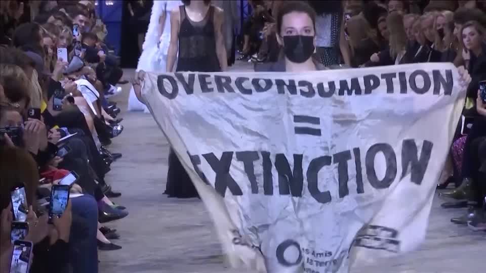 Climate activists storm Louis Vuitton catwalk