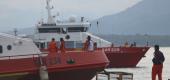 Members of National Search and Rescue Agency stand on a ship as it joins the search for submarine KRI Nanggala that went missing. (AP)