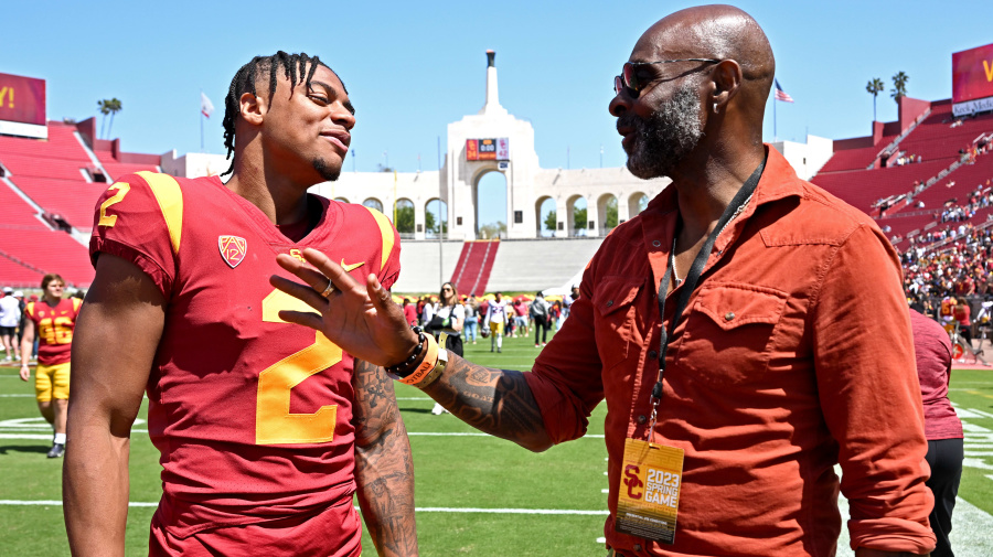 Getty Images - LOS ANGELES, CA - APRIL 15: Former pro football player and member of the Pro Football Hall of Fame, Jerry Rice, talks with his son, Brenden Rice #2 of the USC Trojans, following the spring football game at the Los Angeles Memorial Coliseum on April 15, 2023 in Los Angeles, California. (Photo by Jayne Kamin-Oncea/Getty Images)