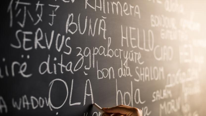 Hello in many languages written with chalk on blackboard