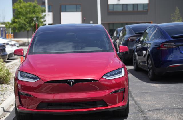 File - An unsold 2023 Model X sports-utility vehicle sits at a Tesla dealership June 18, 2023, in Littleton, Colo. Tesla is recalling more than 2 million vehicles across its model lineup to fix a defective system that's supposed to ensure drivers are paying attention when they use Autopilot. (AP Photo/David Zalubowski, File)