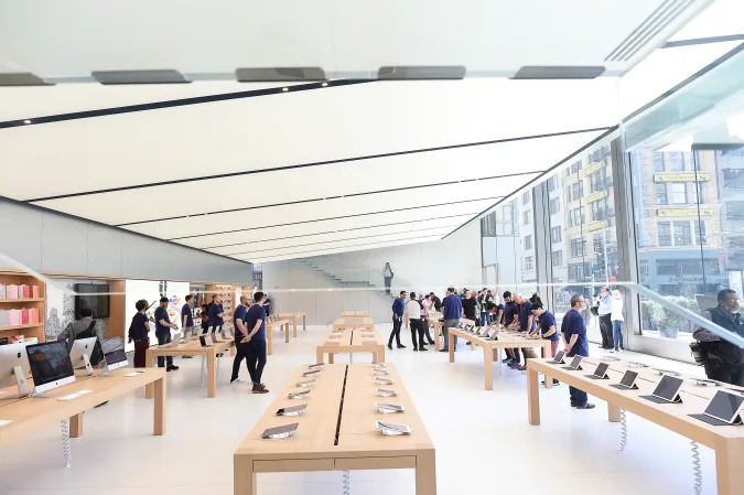 Workers staff a new Apple retail store during a media preview in San Francisco, California, U.S., May 19, 2016. REUTERS/Noah Berger