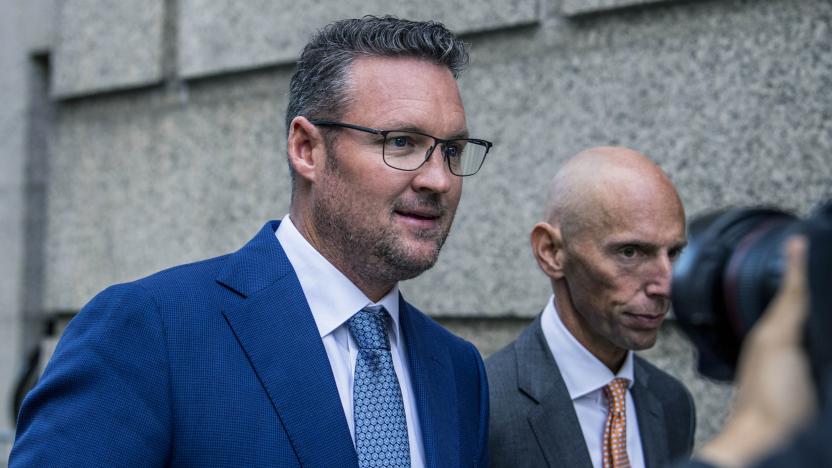 FILE - Trevor Milton, left, leaves the Thurgood Marshall United States Courthouse, Sept. 12, 2022, in New York. In a filing late Tuesday, Nov. 14, 2023, lawyers for Milton, the founder of truck maker Nikola Corp., said he should not face incarceration because his fraud conviction is nothing like the fraud that landed Theranos founder Elizabeth Holmes in prison. (AP Photo/Brittainy Newman, File)