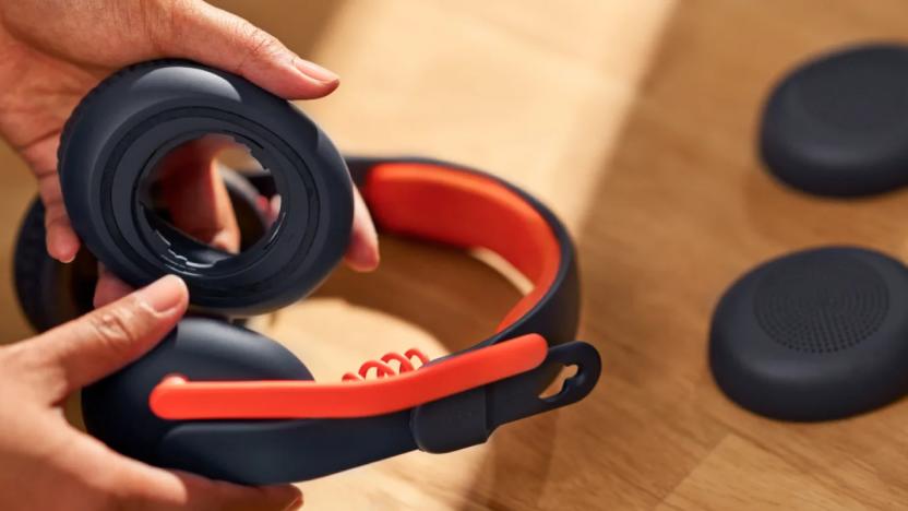 A photo of Logitech's Zone Learn headset with its ear pads being replaced.