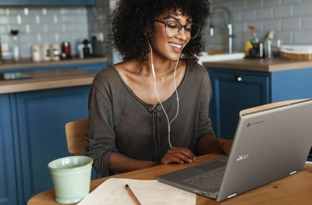 Photo of a woman using Acer's Chromebook Spin 714 laptop.