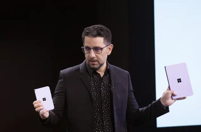 FILE - Microsoft's Chief Product Officer Panos Panay holds a Surface Duo, left, and Surface Neo at an event, Wednesday, Oct. 2, 2019, in New York. Panos Panay is stepping down after nearly 20 years at Microsoft, according to a staff memo Monday, Sept. 18, 2023. (AP Photo/Mark Lennihan, File)