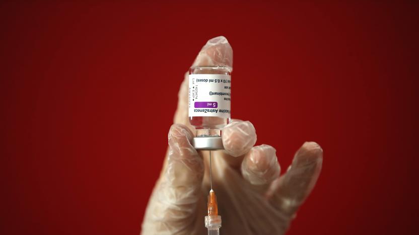 A health worker shows the media how she prepares a dose of the AstraZeneca vaccine to be administered to a patient at a vaccination center set up in front of Rome's Termini central station, Monday, March 8, 2021. (AP Photo/Alessandra Tarantino)