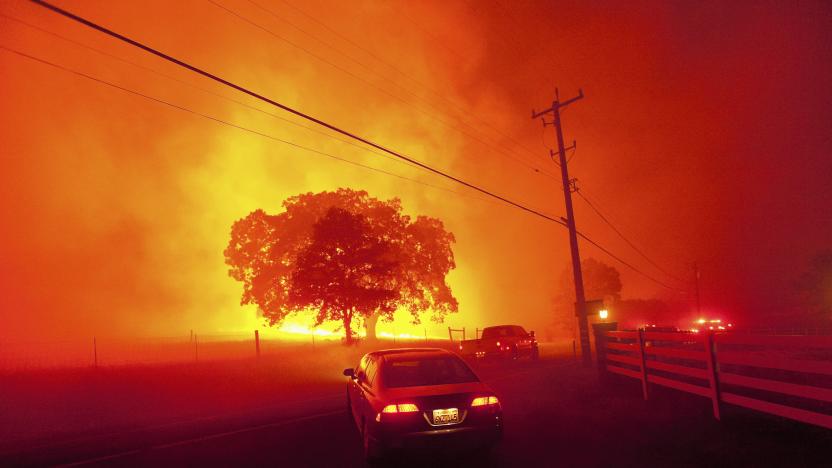 Residents flee as winds whip flames from the Morgan fire along Morgan Territory Road near Clayton, California in unincorporated Contra Costa County September 9, 2013. The blaze, burning in dense, dry scrub, grass and timber in and around Mount Diablo State Park, had scorched some 3,700 acres (1,500 hectares) by Monday afternoon, forcing the evacuation of about 100 homes at the edge of the town of Clayton. REUTERS/Noah Berger (UNITED STATES - Tags: DISASTER ENVIRONMENT SOCIETY TPX IMAGES OF THE DAY)