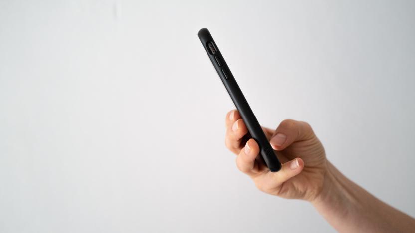 Person using phone against white background