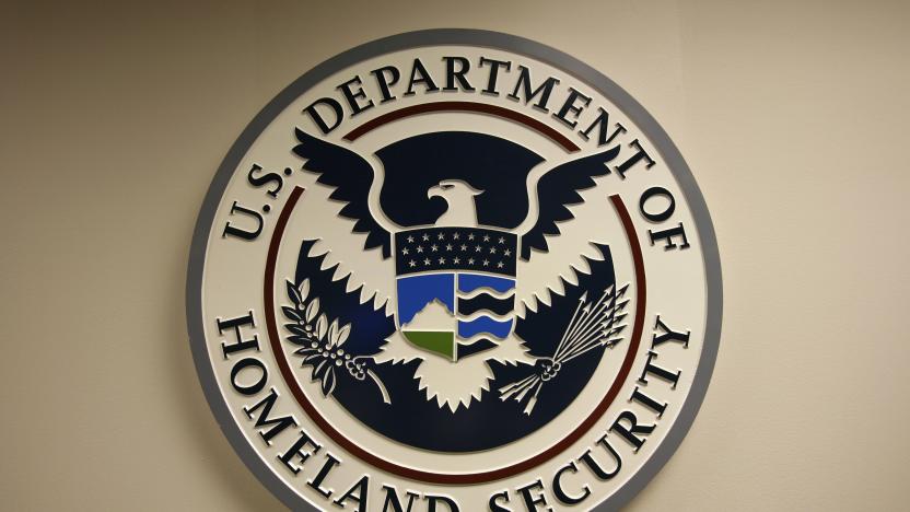 U.S. Department of Homeland Security emblem is pictured at the National Cybersecurity & Communications Integration Center (NCCIC) located just outside Washington in Arlington, Virginia September 24, 2010. U.S. national security planners are proposing that the 21st century's critical infrastructure -- power grids, communications, water utilities, financial networks -- be similarly shielded from cyber marauders and other foes. The ramparts would be virtual, their perimeters policed by the Pentagon and backed by digital weapons capable of circling the globe in milliseconds to knock out targets.  To match Special Report  USA-CYBERWAR/          REUTERS/Hyungwon Kang   (UNITED STATES - Tags: CRIME LAW SCI TECH POLITICS)