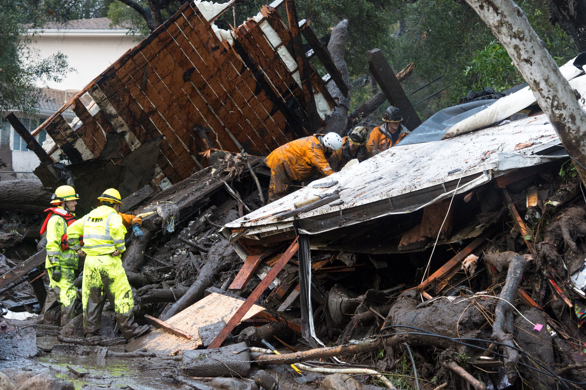 At least 13 killed and thousands evacuated from California mudslides